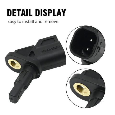 Front ABS wheel speed sensor in black plastic housing with brass bushing and two-pin connector.