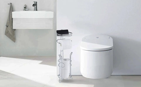 Free Standing Chrome Toilet Paper Holder With Reserve Shelf And Storage Basket near modern toilet in bathroom