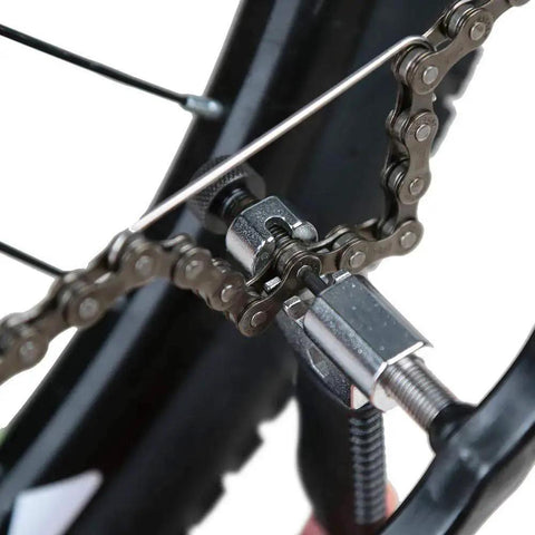 Must Have Universal Bike Chain Tool For Road And Mountain Bikes Chain Breaker And Installer Kit Link Splitter in use on bike chain.