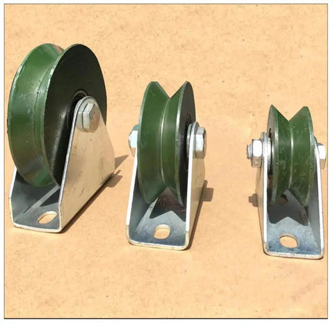 Three Workhorse Heavy Duty Cast Iron V Groove Caster Wheels with Double Bearings for industrial machines and sliding doors.