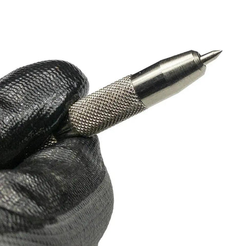 Jiffy Centering Punch For Quick Screw Hole Start In Hinges And Brackets With An Automatic Centering Tip That Slips Right Into Countersunk Holes, Durable Silver Tool From General Tools 806 held in black gloved hand, showing metal tip and textured grip.