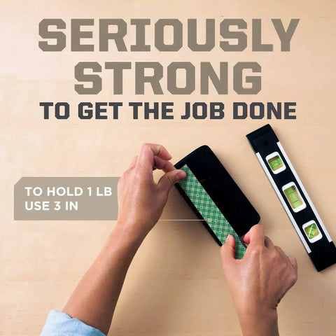 Hands using Indoor Double Sided Mounting Tape 1/2 Inch By 80 Inch With Industrial Strength Adhesive For Painted Surfaces Holds Up To 15 Pounds On Contact