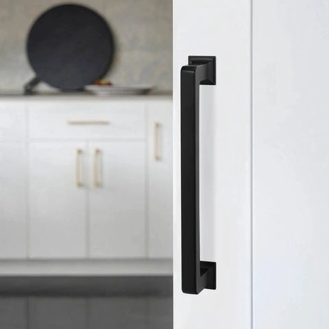 10 Pack Matte Black 5 Inch 128mm Cabinet Handles Zinc Alloy Drawer Pulls installed on white cabinet door in kitchen
