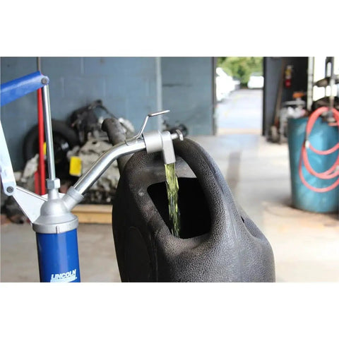Lincoln 1340 Lever Action Barrel Pump For Industrial And Automotive Lubrication And Fluid Transfer in action at a workshop