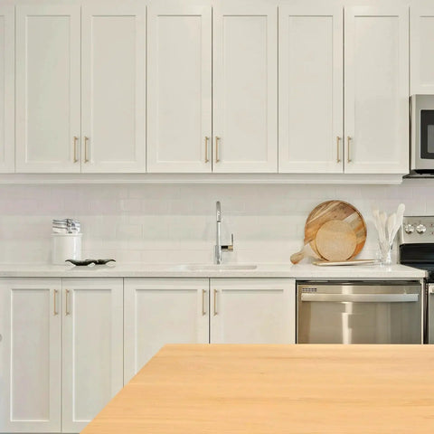 Modern white kitchen with 10 Pack 6 Inch Champagne Bronze Cabinet Handles Stainless Steel Modern Dresser Drawer Pulls on cabinets.