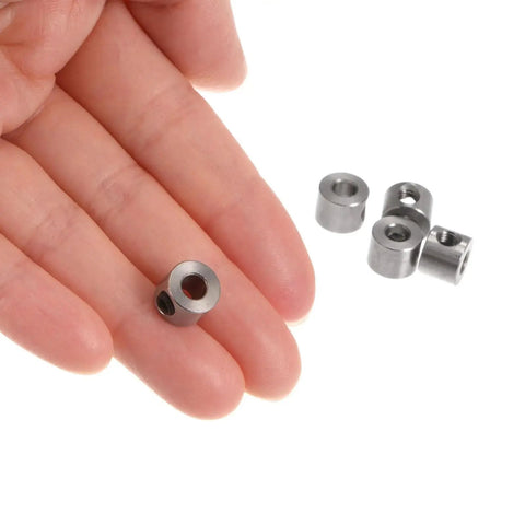 Close-up of 12 Pieces Set Screw Shaft Collars 4mm Bore 9mm Outer Diameter 7mm Width in durable 304 stainless steel for precise positioning.