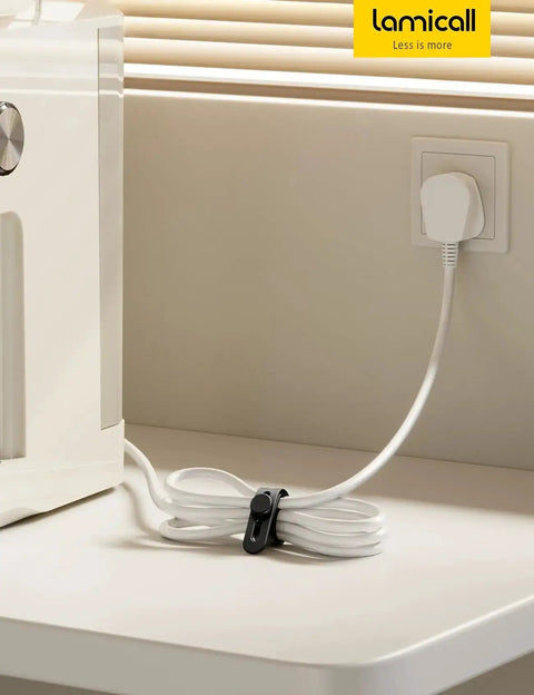 Silicone Cable Ties 10 Pack Cord Organizer with Secure Lock Buckle in use, managing cables on a tabletop, near an outlet.