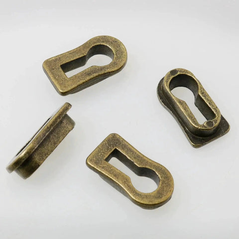 Bronze Tone Zinc Alloy Keyhole Covers Set Of 4 For Cabinet Doors And Drawers Desks Dressers Wardrobes TV Cabinets And More Furniture Hardware Size 22x12x7mm With 19x8mm Keyhole Opening Durable Antique Modern Style