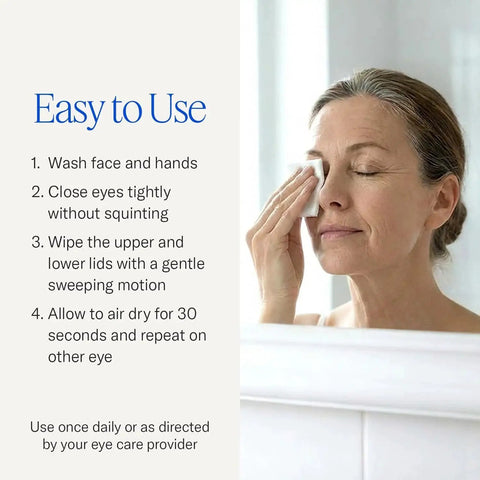 Woman using Natural Eyelid Towelettes for Demodex and Blepharitis Cleanser with Tea Tree Oil in front of mirror