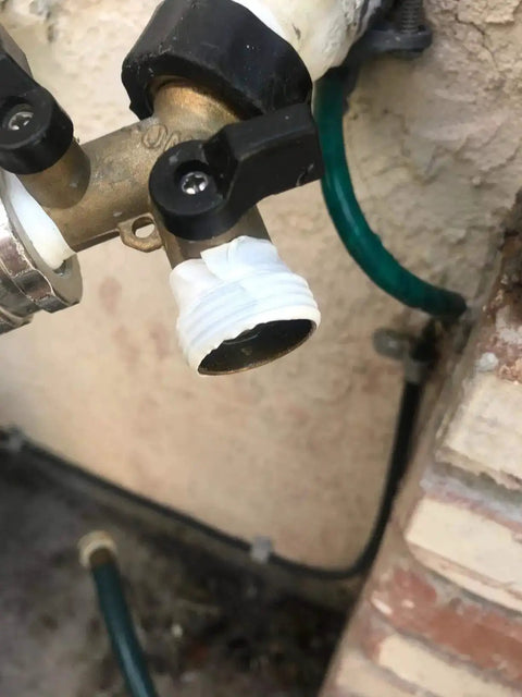 Close-up of PTFE thread seal tape on outdoor faucet fitting; Pro Grade PTFE Thread Seal Tape For Plumbers 1 Inch By 520 Inch Go To Leak Proof Sealant