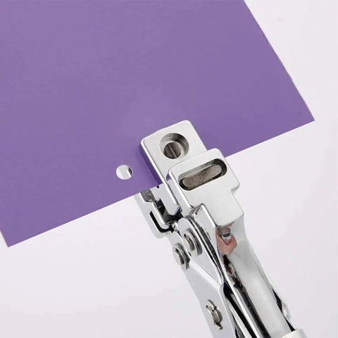 3 In 1 Badge Slot Hole Punch cutting round hole in purple cardstock, all-metal handheld tool for PVC, laminated photos, business cards