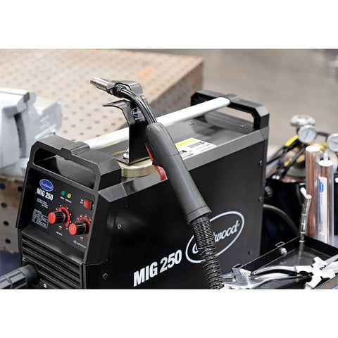 Magnetic MIG Welder Torch Holder Heavy Duty 3mm Steel Powder Coated Finish 2.75in Grippy Magnet in use on welding machine