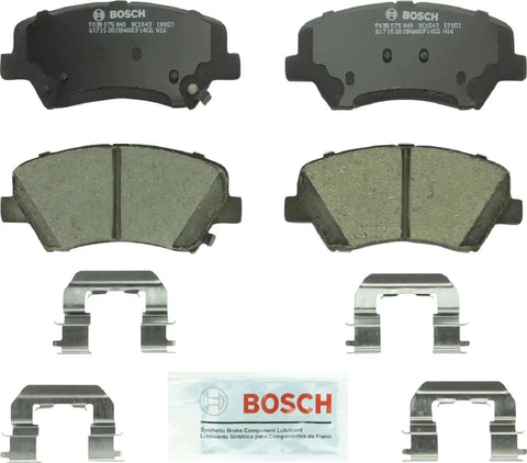 Bosch BC1543 QuietCast ceramic front brake pad set; includes two pads, hardware clips, and lubricant.