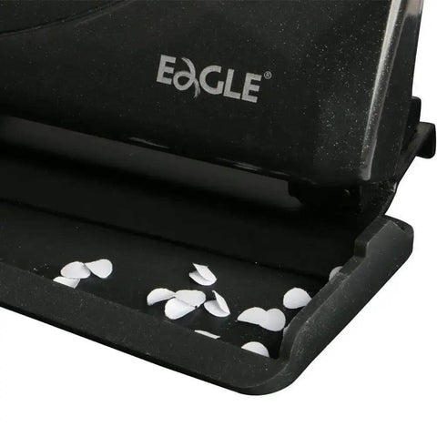 Close-up of black Low-Force No-Fuss 3-Hole Punch For 20-Sheet Capacity, Heavy-Duty Desktop Paper Punch with punched holes visible.