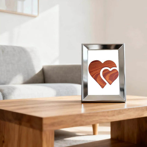 Clear Acrylic Double Heart Router Templates for Woodworking displayed in a frame on a wooden table in a living room setting.
