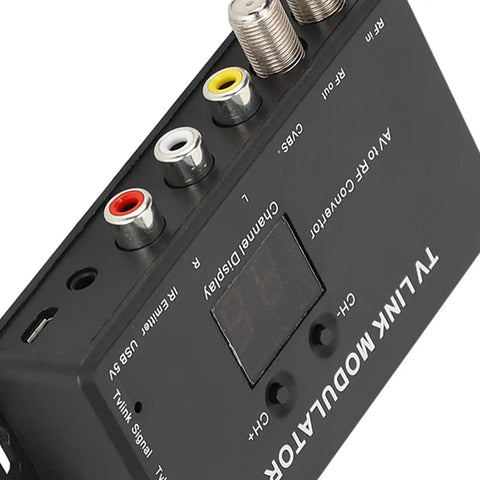 Top view of Compact AV to RF Modulator with adjustable audio level, showing connector ports for DIY cable setups and home theater.