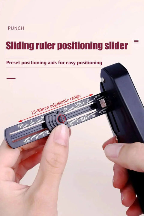 Handheld One Quarter Inch Hole Puncher With Skid Resistant Base, showing sliding ruler positioning slider