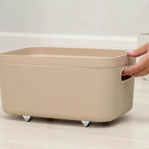 8 Pack Mini Casters 1/2 Inch Low Profile Fixed Caster Wheels With Screws in use on a beige storage box