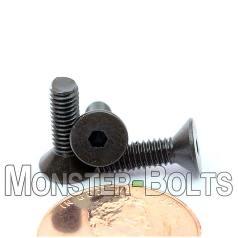 Close-up of Beefy Five Eighths Inch Flat Head Socket Cap Screws Six Forty UNF Alloy Steel Black Oxide Hex Drive