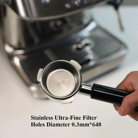 Portafilter, 54mm stainless steel with double spout and black ABS handle; 0.3mm ultra-fine filter holes, shown near espresso machine.