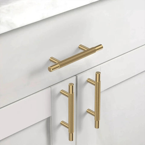 Champagne Bronze Knurled 3 Inch (76mm) Cabinet Handles 10 Pack on white kitchen cabinets.