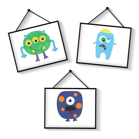 Three framed colorful monster illustrations for kids' rooms, featuring unique designs and vibrant colors, hanging on a white wall.