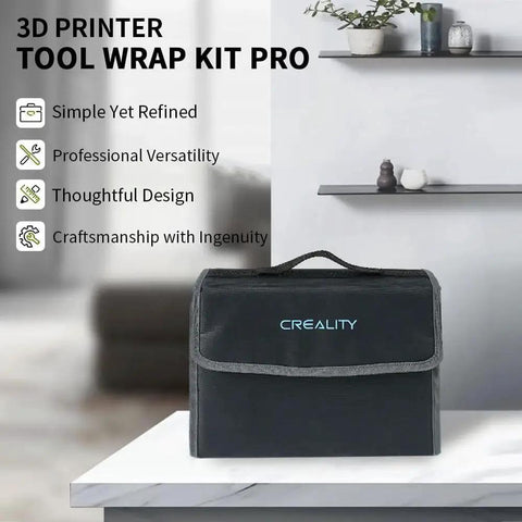 3D Printer Tool Wrap Kit Pro bag on a table with 'Creality' logo, shown in a modern room setting with shelves in the background.