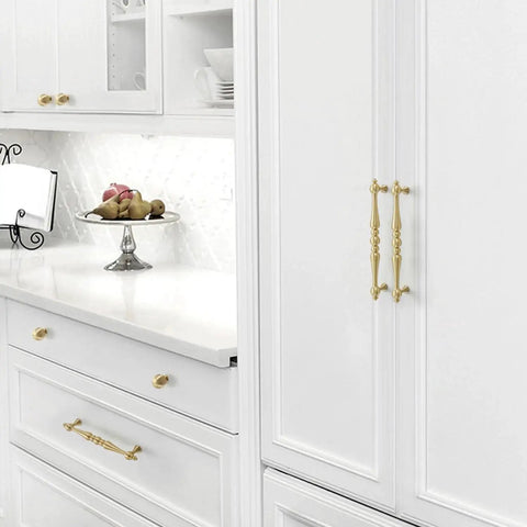 Two Pack 5 Inch Center Solid Brass Cabinet Pulls In Vintage Gold Brushed Finish installed on white kitchen cabinets