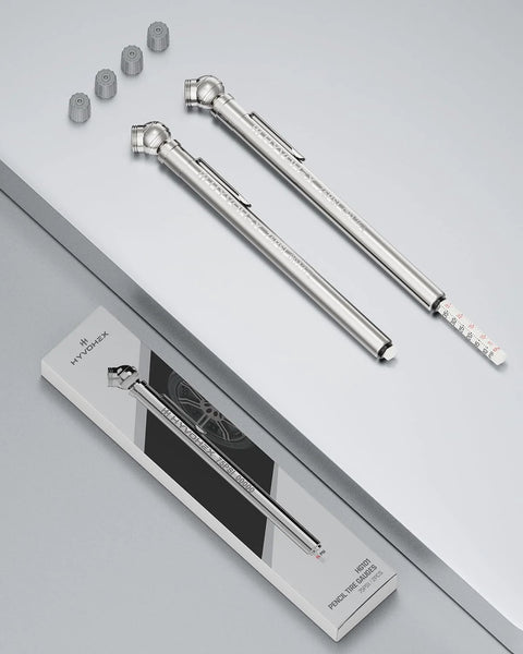 Two pencil-style tire pressure gauges with stainless steel bodies, deflator valves, and included valve caps.