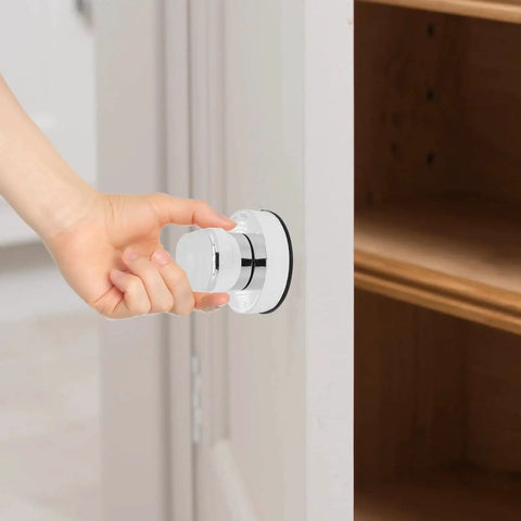 Person using Two Piece Suction Cup Handle Set For Shower Glass Doors And Cabinets No Drill Removable Knob installed on cabinet door.