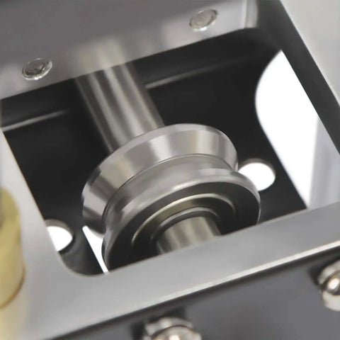 Close-up of V-roller in Sheet Metal Bender Tool With Manual Brake And Shears For Precise 0 To 90 Degree Bends In Iron And Aluminum
