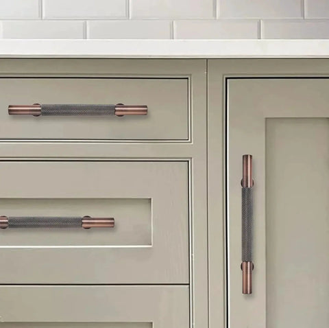 10 Pack 3 Inch Knurled Brushed Antique Copper Cabinet Drawer Pulls installed on white kitchen cabinets