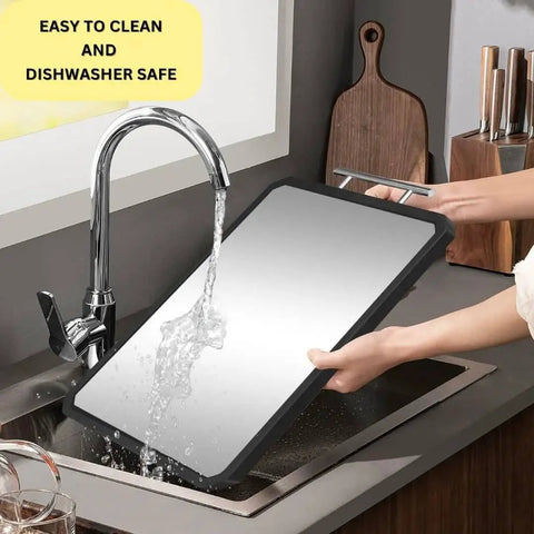 Dual Surface Titanium And Wheat Straw Cutting Board With Juice Groove being washed under a faucet, showcasing juice groove and scratch resistance.