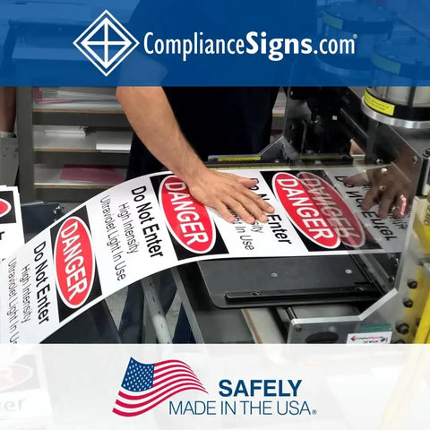 Vinyl Lift Here label decals with down arrows, 5x2 in, 4-pack, installed on industrial machinery