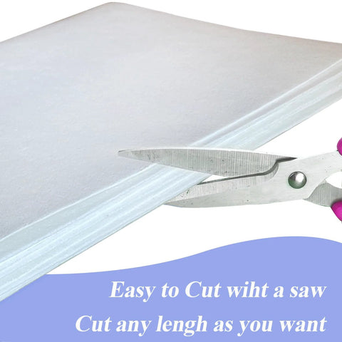 Ceramic fiber paper sheet being cut with scissors; white, 24x33 in, 0.08 in thick, high-temp insulation for kilns.