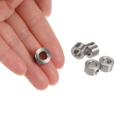 Set Screw Shaft Collars 6mm Bore Stainless Steel 12mm OD 7mm Width Pack Of 10 shown in hand and on surface