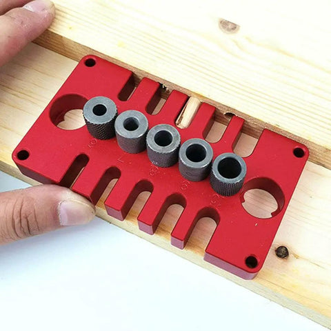 3-In-1 Dowel Jig Drill Guide Block for Woodworking, Aluminum Alloy Hole Locator with installed bushings on wooden board