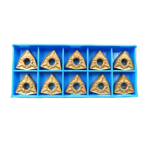 Ten gold WNMG080404-CM carbide inserts in blue packaging. Part of Indexable Boring Bar Set With Five Eighth Inch Shank And Seven Inch Overall Length.