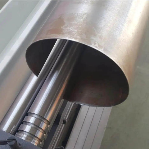 Close-up of 3 In 1 Sheet Metal Cutter, Brake And Slip Roll for 30 Inch 20 Gauge Fabrication, showing metal rolled on machine.