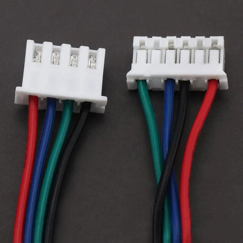 Close-up of Six Pack 1.5 Meter Stepper Motor Cables XH2.54 4P To XH2.0 6P Color Wires For 3D Printer with white connectors.
