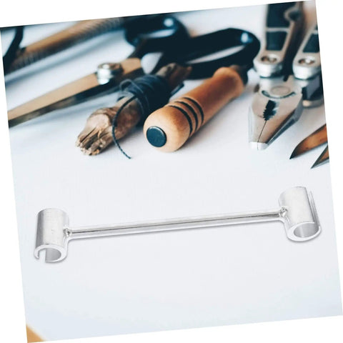 Beefy Heavy Duty Hinge Adjustment Wrench Tool For Door Repair on a table with other tools, precise hinge gap alignment