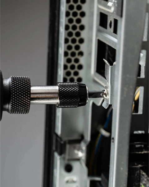 Close-up of a 32 Piece Pro Grade Tamper Proof Security Bit Set With Torx Hex Tri Wing Spanner And Clutch Bits Quick Release Bit Holder One Quarter Inch Adapter For Electric Drills And Impact Drivers in use