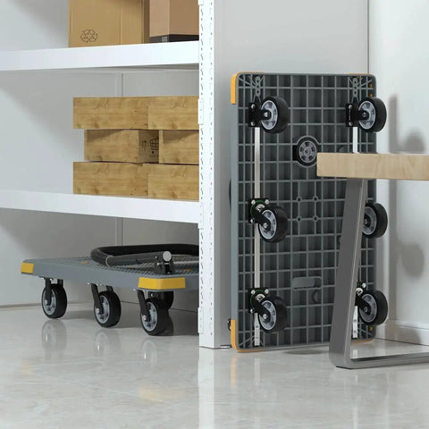 Foldable Heavy Duty Platform Cart With 1764 Pound Capacity stored upright against a wall, showcasing six wheels including a spare