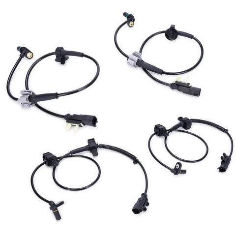 Set of four black ABS wheel speed sensors with gray connector housings and wiring for front and rear wheels.