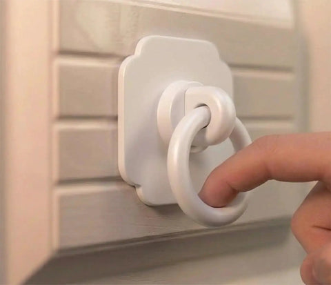 Four Pack Satin White Cabinet And Bifold Ring Pull Handles With One And Three Fifths Inch Backplate installed on louvered cabinet door