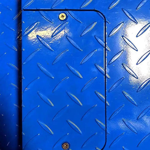 Close-up of blue diamond plate surface on Beefy Heavy Duty Industrial Floor Scale With Carbon Steel Ramp For Pallet Weighing In Warehouse.