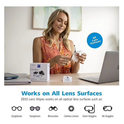 Person using Zeiss Lens Wipes 120 Pack Pre Moistened For Camera And Optics Cleaning at a desk with packaging visible