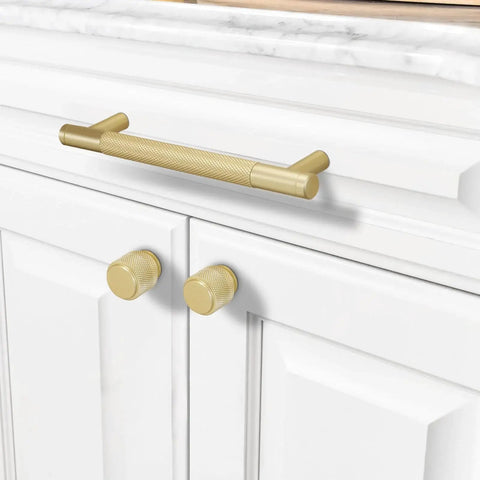 10 Pack 5 Inch Brushed Brass Knurled Cabinet Handles for Kitchen Cabinets Gold Pulls and Door Hardware installed on white cabinet