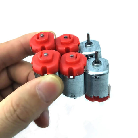 Six Pack DC Motors Kit For DIY Projects With Mini Electric Hobby Motors 3V To 12V Up To 25000 RPM shown in a hand