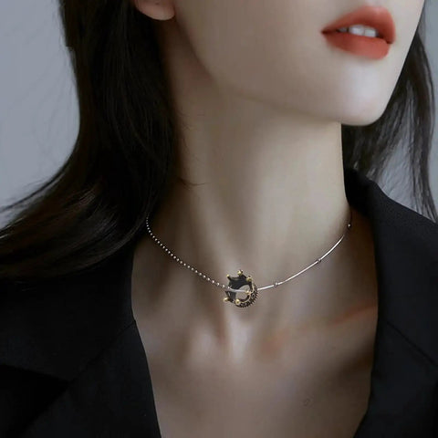 Model wearing necklace with small 3D alloy crown charm, ideal for DIY jewelry making, showcasing 120 pcs mini crown charms 3D alloy king crown beads bulk large hole spacer beads for jewelry making DIY craft bracelet necklace supplies bling ready for bead artists and DIY jewelry lovers ideal for craft projects and jewelry making on the regular.